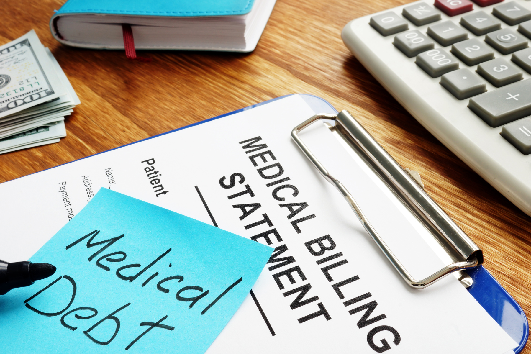 Medical debt with billing statement with clipboard.